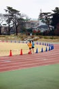 Runners running along the track