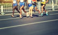 Runners running on city road Royalty Free Stock Photo