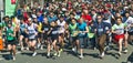 Runners at a start point just a few seconds after starting their run