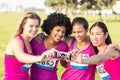 Runners supporting breast cancer marathon and taking selfies