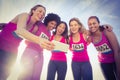 Runners supporting breast cancer marathon and taking selfies