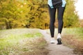 Running along a park path, healthcare and problem concept - close-up of an unhappy person suffering from pain in the leg or knee Royalty Free Stock Photo