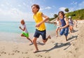 Running along the sea water group of kids Royalty Free Stock Photo