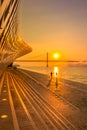 Running along Tagus River at Gorgeous Orange Sunrise in Belem, Lisbon, Portugal Royalty Free Stock Photo