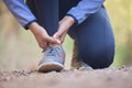 Running, ankle pain and injury with shoes of black woman on nature trail for training, jogging and endurance. Sprain Royalty Free Stock Photo