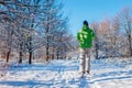 Running athlete man sprinting in winter forest. Training outside in cold snowy weather. Active healthy way of life Royalty Free Stock Photo