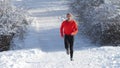 Running athlete in the snow