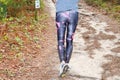 Running athlete woman walking exercise healthy and lifestyle concept in wooden pathway forest park Royalty Free Stock Photo