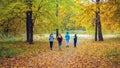 Running athletes in the park on a run in the early morning. Several children are running in the woods doing sports Royalty Free Stock Photo