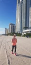 Running on The Beach in Sunny Isle Beach Florida with footprints in the sand Royalty Free Stock Photo