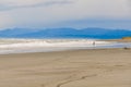 Running boy at Sunset in Hokitika, New Zealand