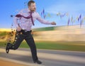 Running businessman in a hurry on blurred background Royalty Free Stock Photo