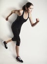 Running caucasian woman studio isolated on bg with blur motion s