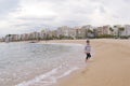 Running child on the beach. Amazing view on beach and sea. Blanes, Costa Brava, Catalonia, Spain Royalty Free Stock Photo