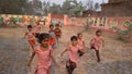 Running children in compitation Indian government school having real smile on their face under the boundary