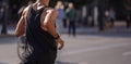 Running in the city roads. Young man runner, back view, blur background, banner, copy space Royalty Free Stock Photo