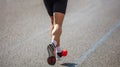 Running in the city roads. Young man runner, back view, blur background, copy space Royalty Free Stock Photo