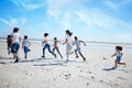 Running family, beach and adoption kids with happiness, bonding and sand with speed on summer vacation. Women, children Royalty Free Stock Photo