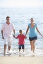 Running Family On Beach Holiday Royalty Free Stock Photo