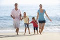 Running Family On Beach Holiday Royalty Free Stock Photo