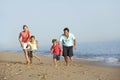 Running Family On Beach Holiday Royalty Free Stock Photo