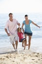 Running Family On Beach Holiday Royalty Free Stock Photo