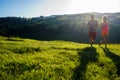 Running fitness couple of runners doing sport on road outdoor. Active living man and woman jogging training cardio Royalty Free Stock Photo