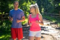 Running fitness couple of runners doing sport on road outdoor. Active living man and woman jogging training cardio Royalty Free Stock Photo