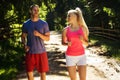 Running fitness couple of runners doing sport on road outdoor. Active living man and woman jogging training cardio Royalty Free Stock Photo