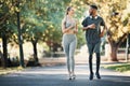 Running, fitness and interracial couple in nature for cardio, exercise and marathon training. Workout, sports and young Royalty Free Stock Photo