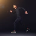 Running, fitness and man with workout, exercise and training on a black studio background. Person, mockup space and Royalty Free Stock Photo
