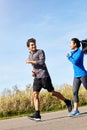 Running generates the best of moods. a sporty young couple exercising together outdoors. Royalty Free Stock Photo