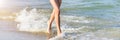 Running girl legs on the sea beach. Long summer banner with copy space. Close up of a young girl& x27;s legs walking or Royalty Free Stock Photo