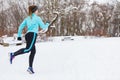 Running girl wearing sportswear, winter fitness Royalty Free Stock Photo