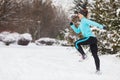 Running girl wearing sportswear, winter fitness Royalty Free Stock Photo