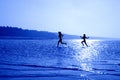 Running girls in blue #2 Royalty Free Stock Photo