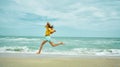 Running happy woman on sandy sea beach, enjoying seascape, feeling freedom. Royalty Free Stock Photo