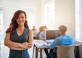 Running her office with confidence and determination. Portrait of a confident young woman working a modern office with Royalty Free Stock Photo