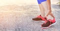 Running injury leg accident- sport woman runner hurting holding painful sprained ankle in pain. Royalty Free Stock Photo