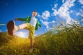 Running little happy boy in the meadow weat field Royalty Free Stock Photo