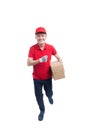 Running Male courier company worker delivering a package / isolated on white background. Royalty Free Stock Photo