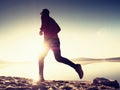 Running man on beach. Sportsman run in baseball cap Royalty Free Stock Photo