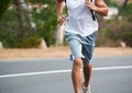 Running, man and exercise in street for fitness, workout and commitment in training for marathon. Runner, freedom and