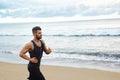 Running Man Jogging At Beach During Fitness Workout Outdoor. Sports Royalty Free Stock Photo