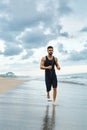 Running Man Jogging At Beach During Fitness Workout Outdoor. Sport Royalty Free Stock Photo