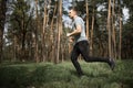 Running man. Male runner jogging at the park. Guy training outdoors. Exercising on forest path. Healthy lifestyle Royalty Free Stock Photo