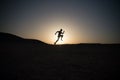 Running man silhouette at sunset sky Royalty Free Stock Photo