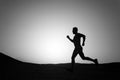Running man silhouette at sunset sky Royalty Free Stock Photo
