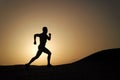 Running man silhouette at sunset sky Royalty Free Stock Photo