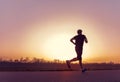 Running man silhouette in sunset time Royalty Free Stock Photo